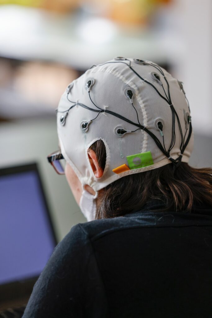 Research participant wearing skullcap equipment